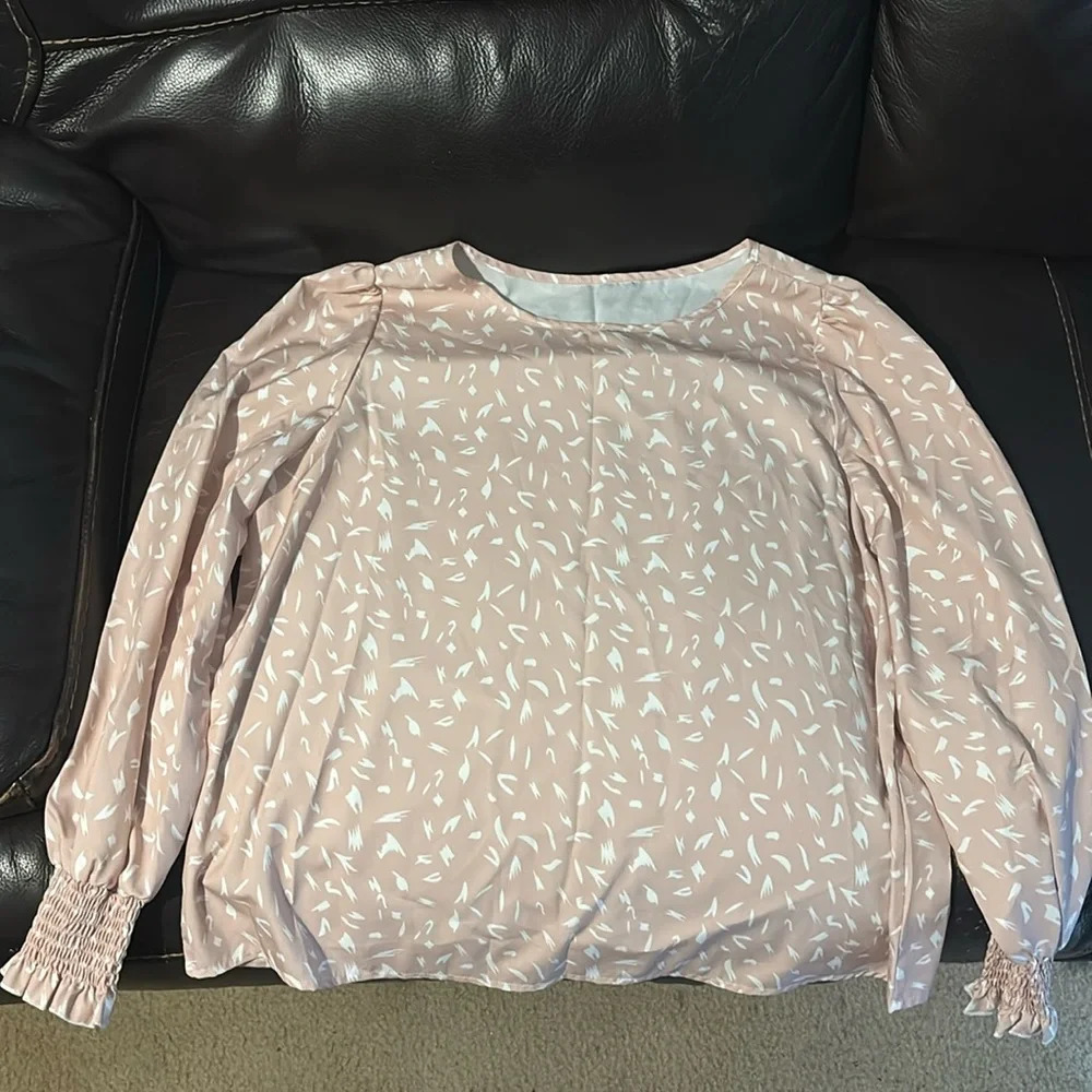 Pink and white blouse with ruffled sleeves